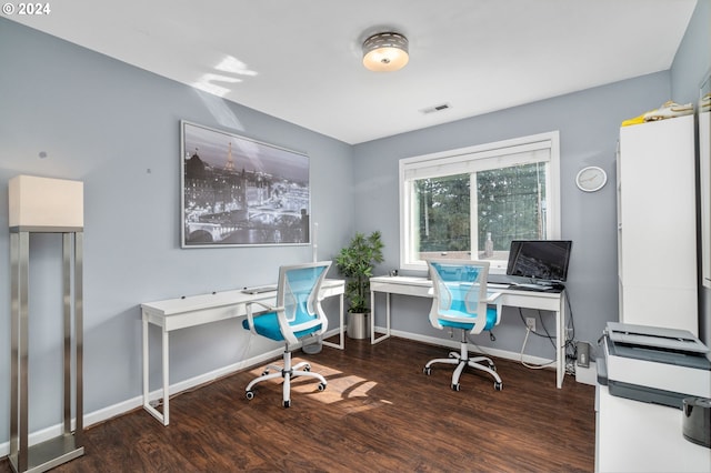 office area featuring visible vents, baseboards, and wood finished floors