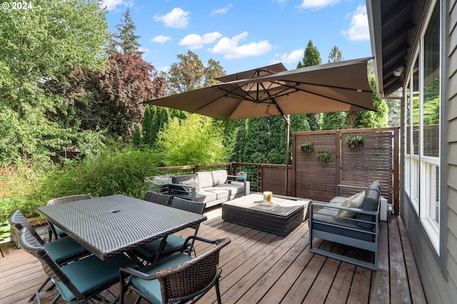 wooden terrace with an outdoor living space and outdoor dining space