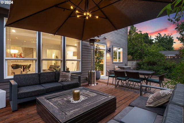 wooden terrace featuring an outdoor living space and outdoor dining area