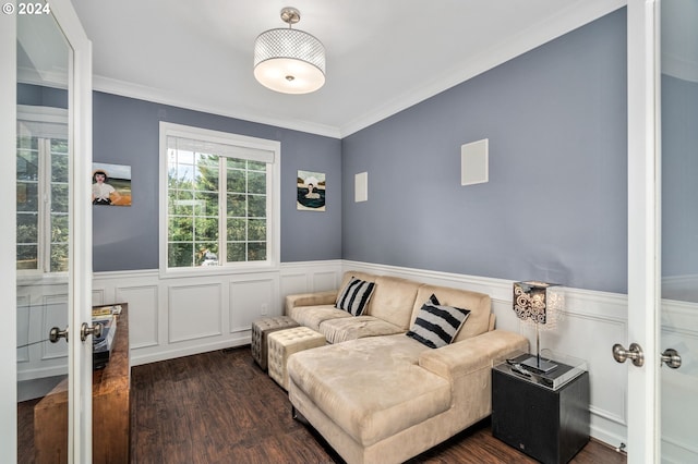 interior space featuring dark wood finished floors, a wainscoted wall, french doors, and crown molding