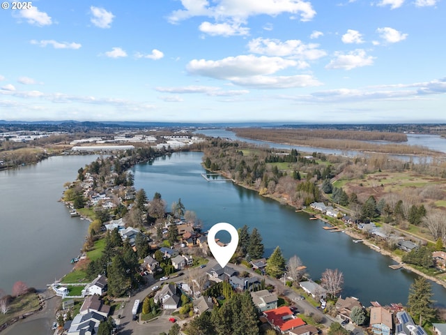 drone / aerial view with a residential view and a water view