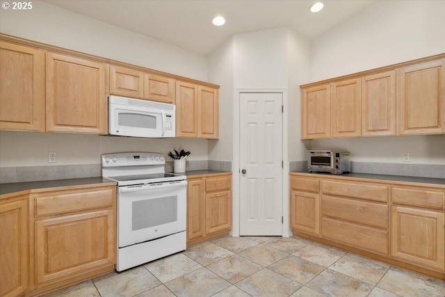 853 NE Cobblestone Ct, Prineville, OR 97754 - kitchen with white appliances, light brown cabinetry, recessed lighting, and dark countertops