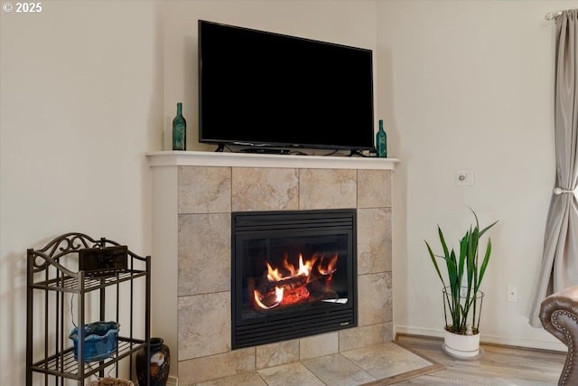 853 NE Cobblestone Ct, Prineville, OR 97754 - detailed view of a fireplace, wood finished floors, and baseboards
