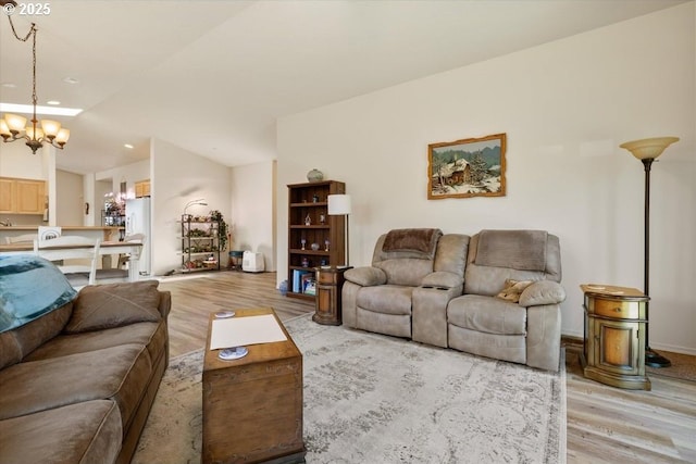 853 NE Cobblestone Ct, Prineville, OR 97754 - living room with light wood-style floors, a chandelier, and recessed lighting