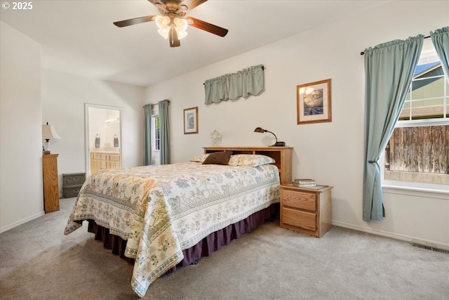 853 NE Cobblestone Ct, Prineville, OR 97754 - bedroom with light carpet, a ceiling fan, connected bathroom, and baseboards