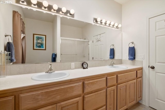 853 NE Cobblestone Ct, Prineville, OR 97754 - bathroom featuring double vanity and a shower with door