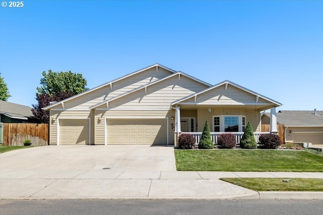 853 NE Cobblestone Ct, Prineville, OR 97754 - craftsman-style house featuring a garage, driveway, and a porch
