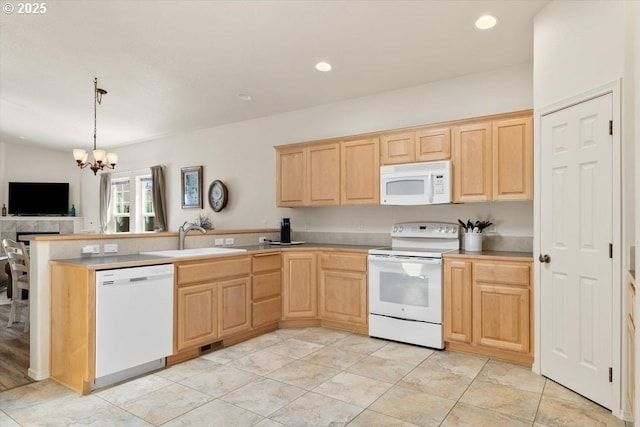 853 NE Cobblestone Ct, Prineville, OR 97754 - kitchen with white appliances, a sink, light brown cabinets, and recessed lighting