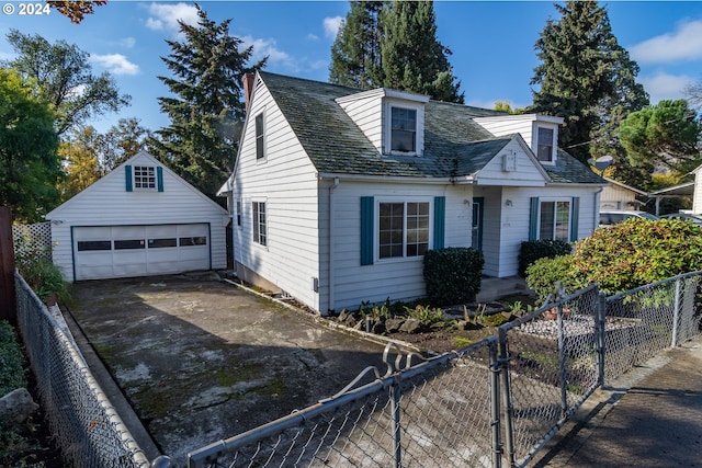1772 SE Hamilton St, Roseburg, OR 97470 - cape cod-style house featuring a detached garage, an outdoor structure, and a fenced front yard