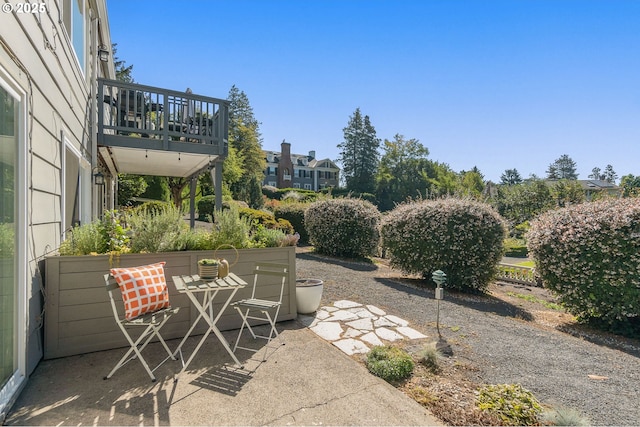 view of patio with a balcony