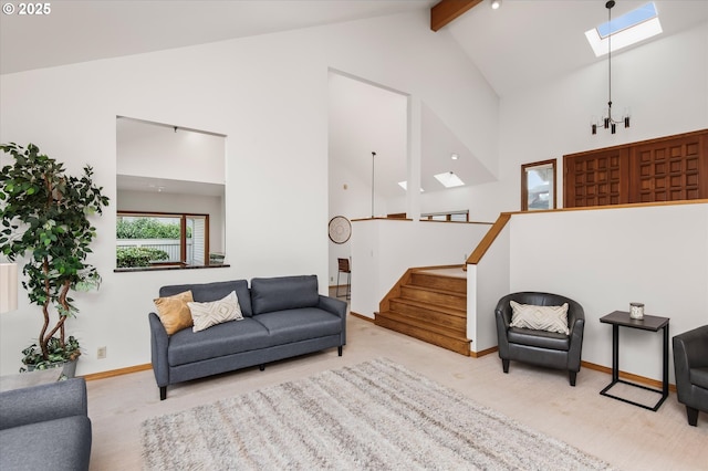 living area with light carpet, high vaulted ceiling, stairway, and a skylight