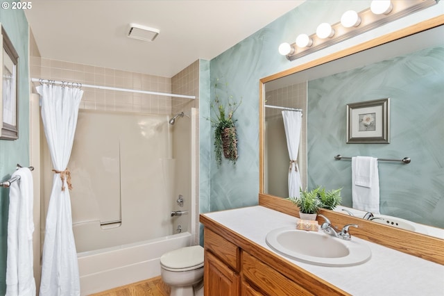 full bath with shower / bath combo, vanity, and toilet