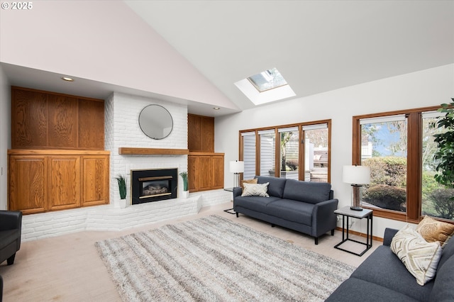 living room with a skylight, light colored carpet, a brick fireplace, high vaulted ceiling, and recessed lighting