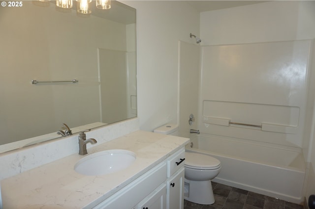 bathroom with a chandelier, shower / bathing tub combination, vanity, and toilet