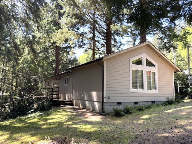 5336 Buckskin Bob, Florence, OR 97439 - view of property exterior with a lawn, a wooden deck, and crawl space