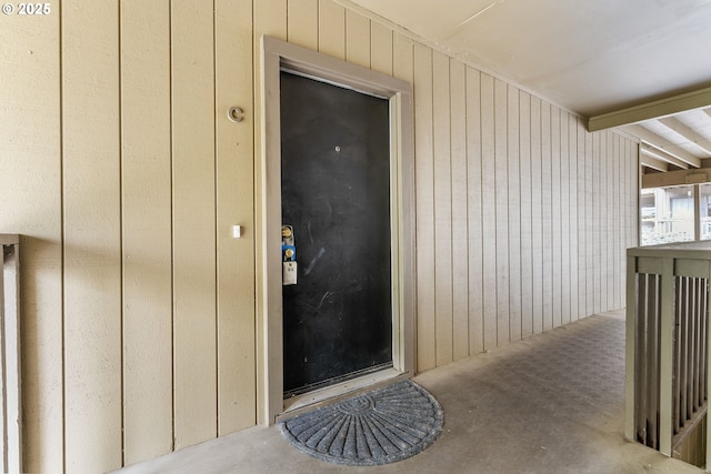 view of exterior entry featuring board and batten siding