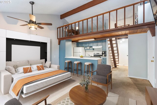 kitchen featuring beam ceiling, electric range, blue cabinets, light colored carpet, and white fridge