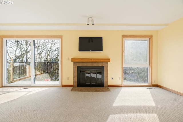 unfurnished living room with carpet flooring