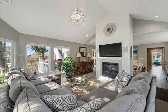 465 SW Edgewater, Depoe Bay, OR 97341 - living room with light wood-style flooring, high vaulted ceiling, a fireplace, a chandelier, and recessed lighting