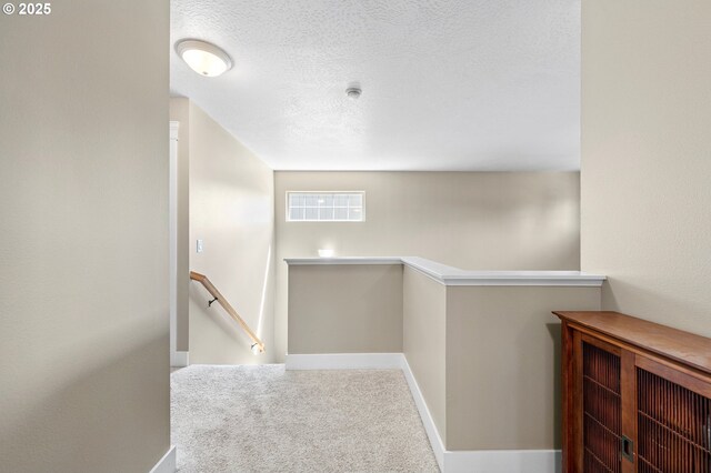 3647 Lodenquai Ln, Eugene, OR 97404 - stairs featuring carpet flooring, baseboards, and a textured ceiling