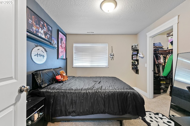 3647 Lodenquai Ln, Eugene, OR 97404 - carpeted bedroom featuring a textured ceiling, a closet, and a spacious closet