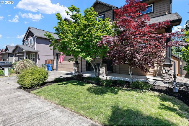 3647 Lodenquai Ln, Eugene, OR 97404 - view of front of property featuring concrete driveway, a front lawn, an attached garage, and covered porch