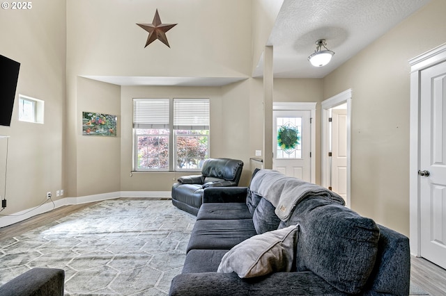3647 Lodenquai Ln, Eugene, OR 97404 - living room featuring wood finished floors, plenty of natural light, and baseboards