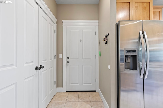 3647 Lodenquai Ln, Eugene, OR 97404 - doorway to outside with light tile patterned floors and baseboards