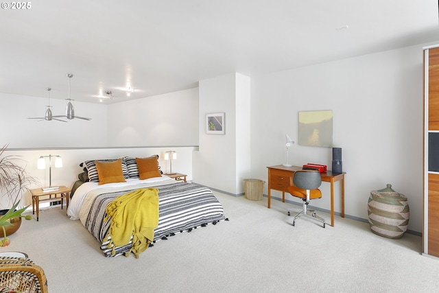 bedroom with baseboards and carpet