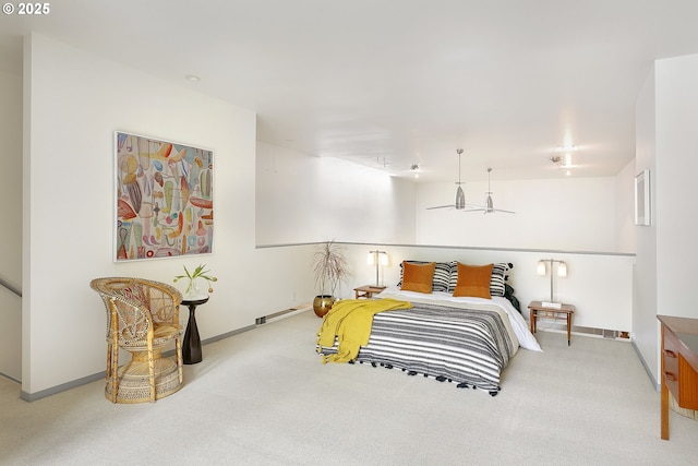 bedroom featuring baseboards and carpet