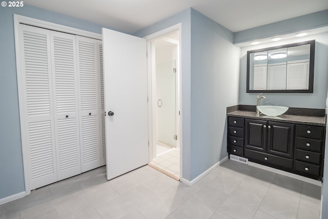 2915 Chuckanut St, Eugene, OR 97408 - bathroom with a closet, vanity, and tile patterned flooring