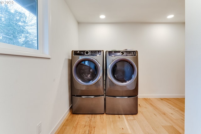 2915 Chuckanut St, Eugene, OR 97408 - laundry area featuring washing machine and clothes dryer, wood finished floors, and recessed lighting