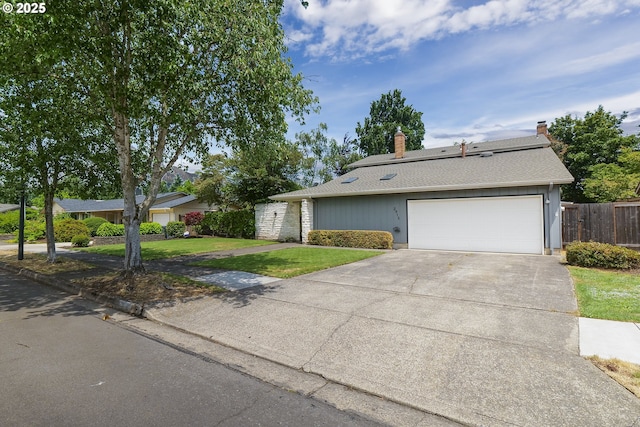 2915 Chuckanut St, Eugene, OR 97408 - view of front facade featuring concrete driveway, an attached garage, a chimney, and a shingled roof