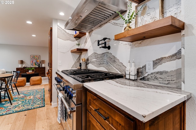 2915 Chuckanut St, Eugene, OR 97408 - kitchen featuring double oven range, open shelves, ventilation hood, light wood finished floors, and recessed lighting