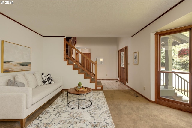 carpeted living room with baseboards, stairs, ornamental molding, and a textured ceiling