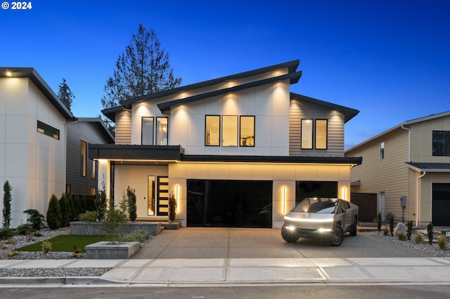 modern home with a garage and central AC unit