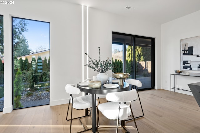 dining space featuring light hardwood / wood-style flooring