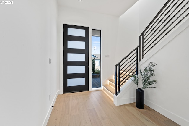 foyer with light hardwood / wood-style floors