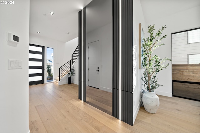 foyer entrance with light hardwood / wood-style floors