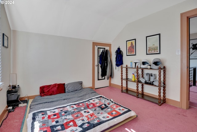 bedroom with light carpet and vaulted ceiling