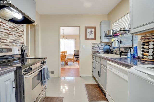 kitchen with stainless steel electric range oven, tasteful backsplash, light tile floors, dishwasher, and custom exhaust hood