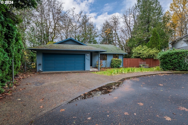 single story home with a garage