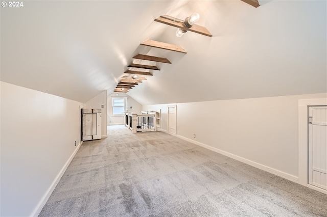 bonus room featuring light colored carpet and lofted ceiling