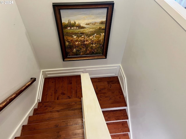 stairway featuring hardwood / wood-style floors