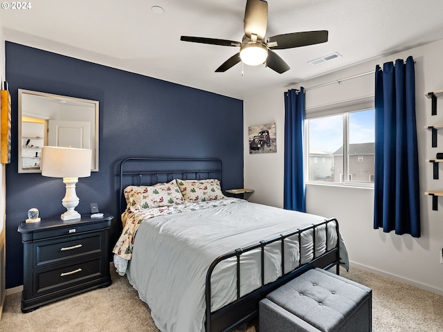 bedroom featuring ceiling fan and light colored carpet