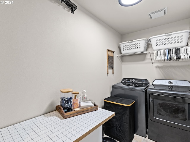 washroom featuring washer and clothes dryer