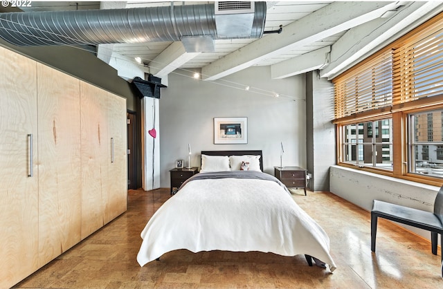 bedroom featuring beam ceiling