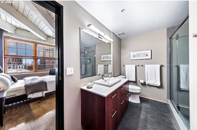 bathroom with an enclosed shower, vaulted ceiling, hardwood / wood-style floors, vanity, and toilet