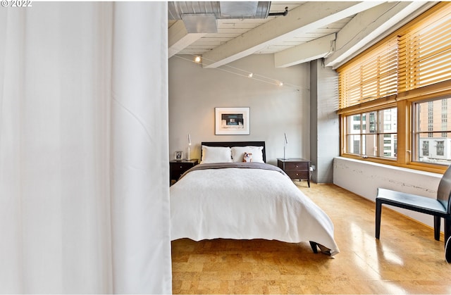 bedroom featuring beamed ceiling