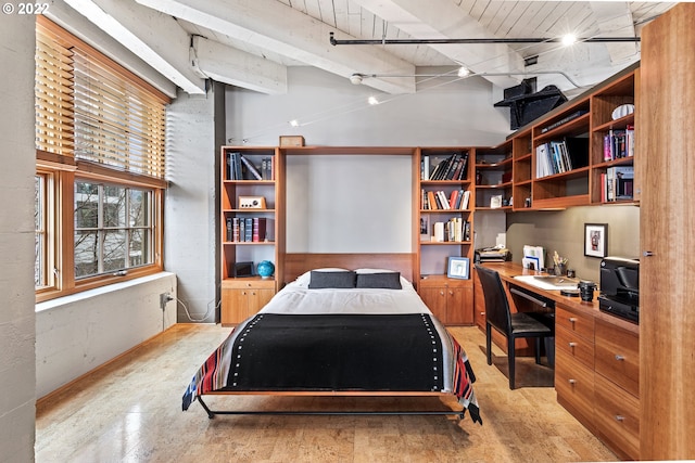 bedroom featuring built in desk